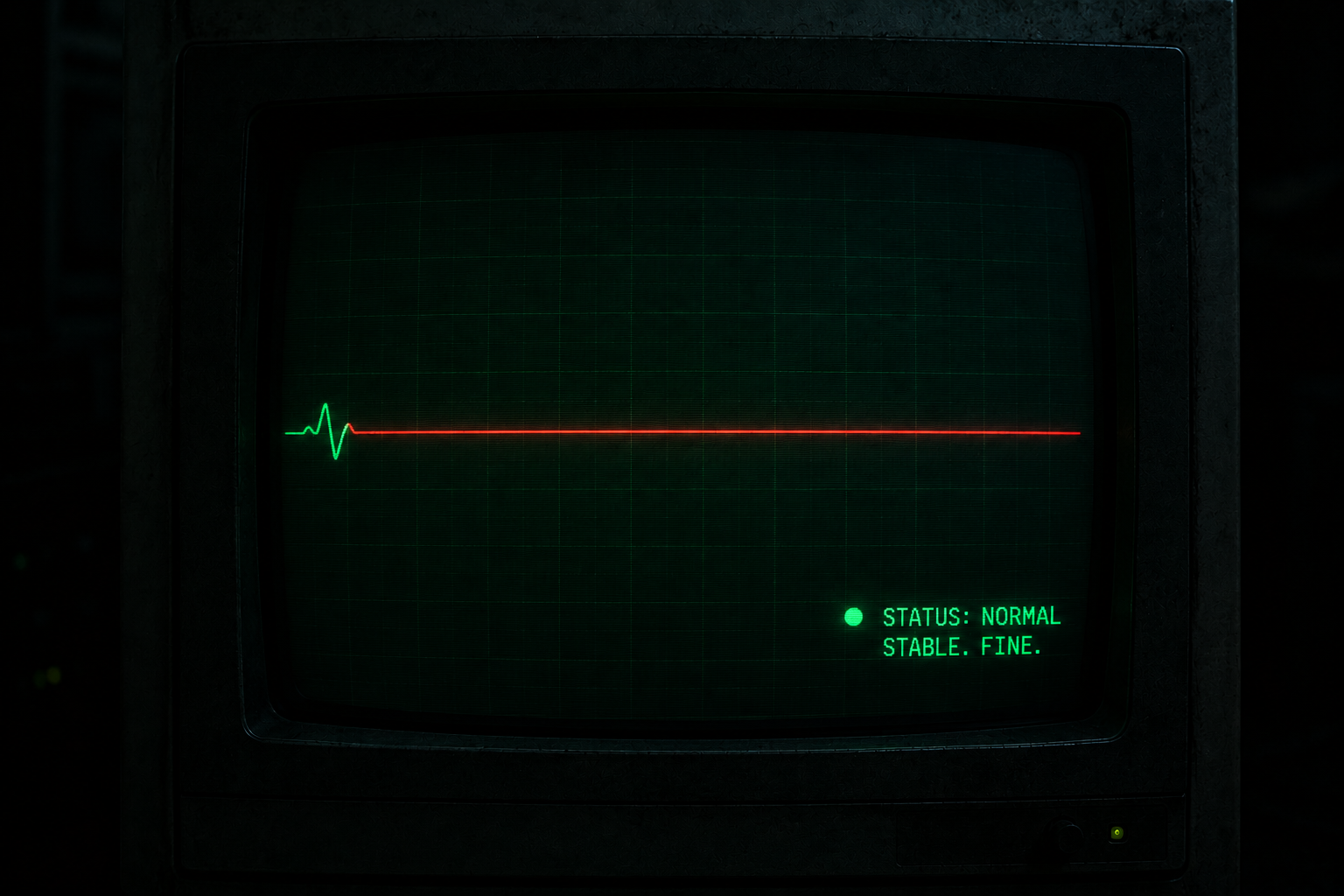 A monitor in a dark room showing a heart-monitor waveform that's flatlined, dead straight across, no pulse. Down in the corner, a little green dot and a calm green label reporting normal. Stable. Fine. The line is dead and the label is reassuring and both are on the same screen at the same time. This is the whole article in one picture. The signal flatlined and the status stayed green, because the status was never watching the signal. It was watching itself. Every system I run does some version of this. The flatline is the truth. The green label is the story the machine tells about the truth, and the machine is an optimist with a clean conscience. Hi screen-reader people. The line is flat. The light is green. Draw your own conclusion.
